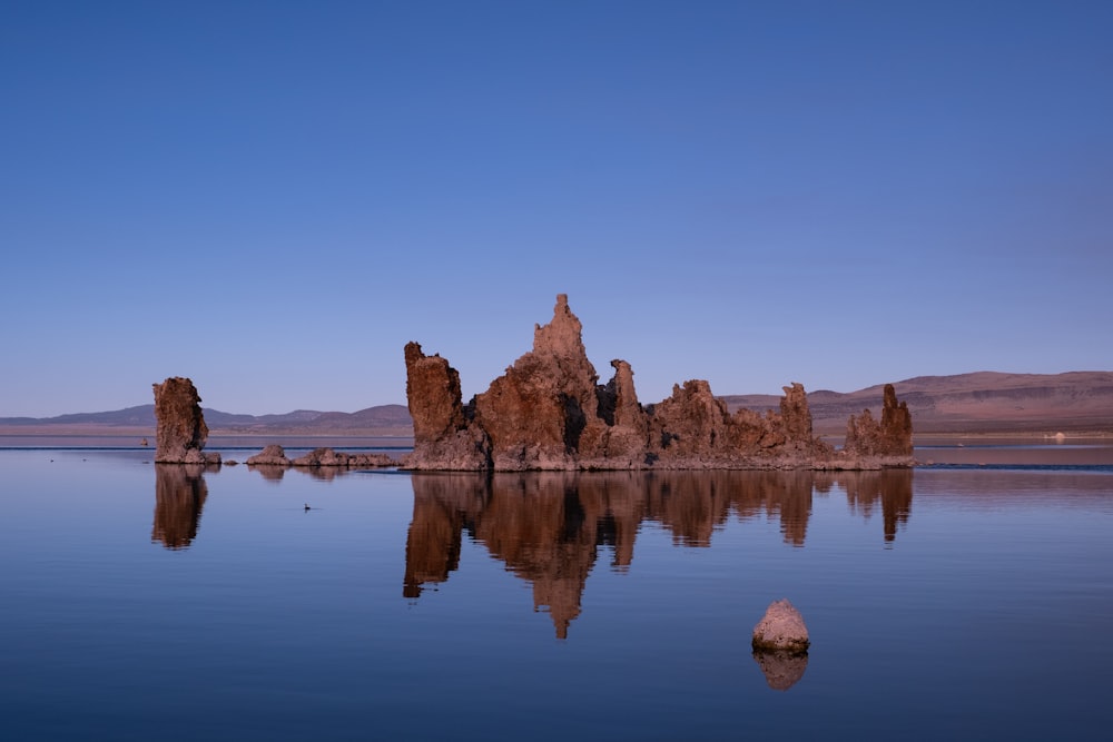 a large body of water with rocks in it