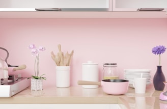 A bright and cheerful kitchen countertop with colorful Tupperware, glass containers, and utensils neatly arranged.