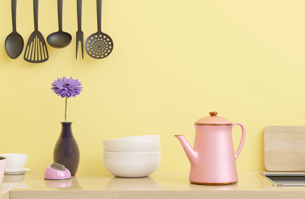 a yellow wall with various kitchen utensils on it