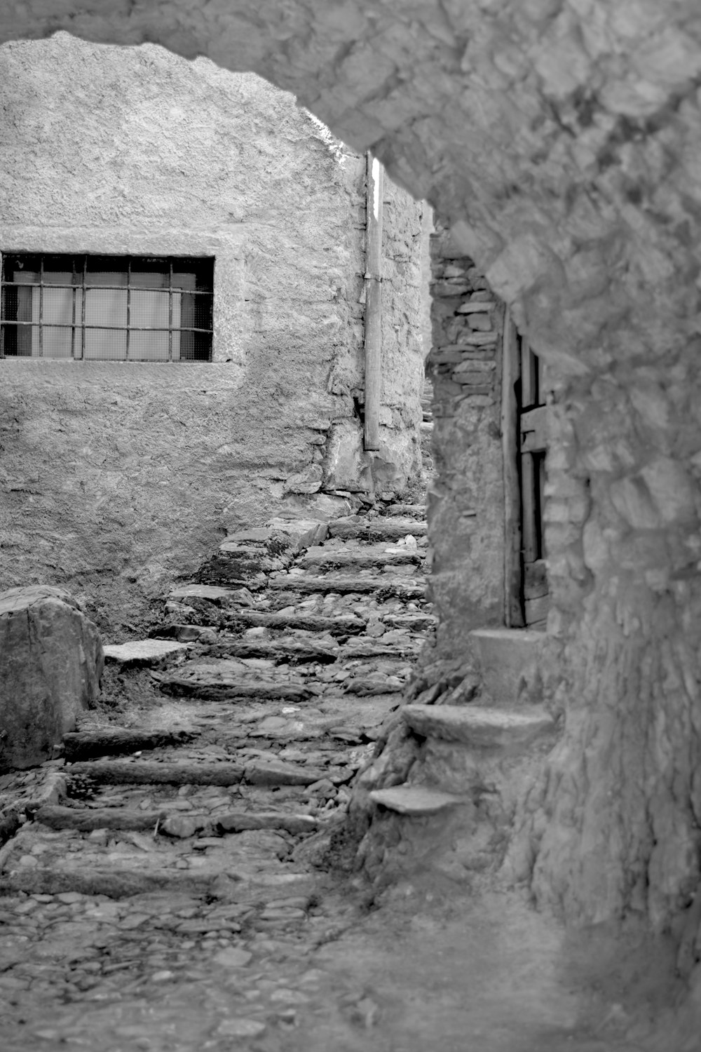 a black and white photo of a stone building