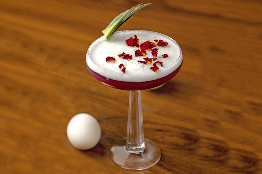 a cocktail with a garnish garnish garnish garnish