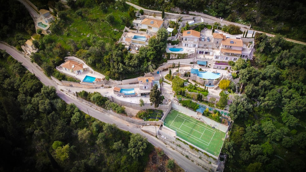 an aerial view of a tennis court and a tennis court