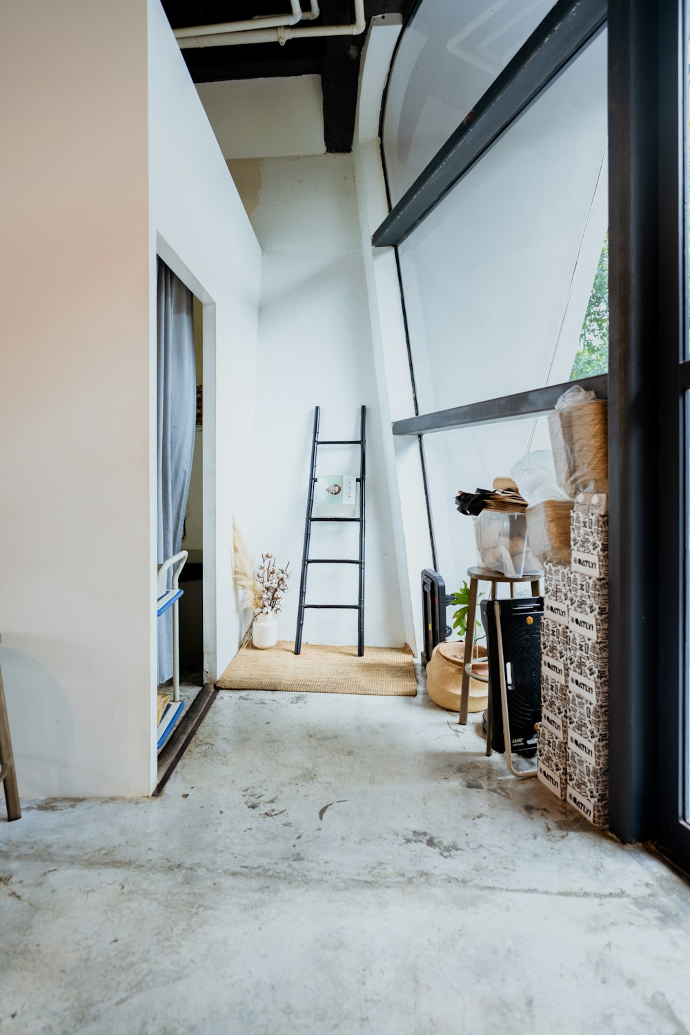 a room with a ladder and a window