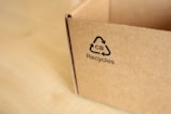 a cardboard box with a recyclies logo on it