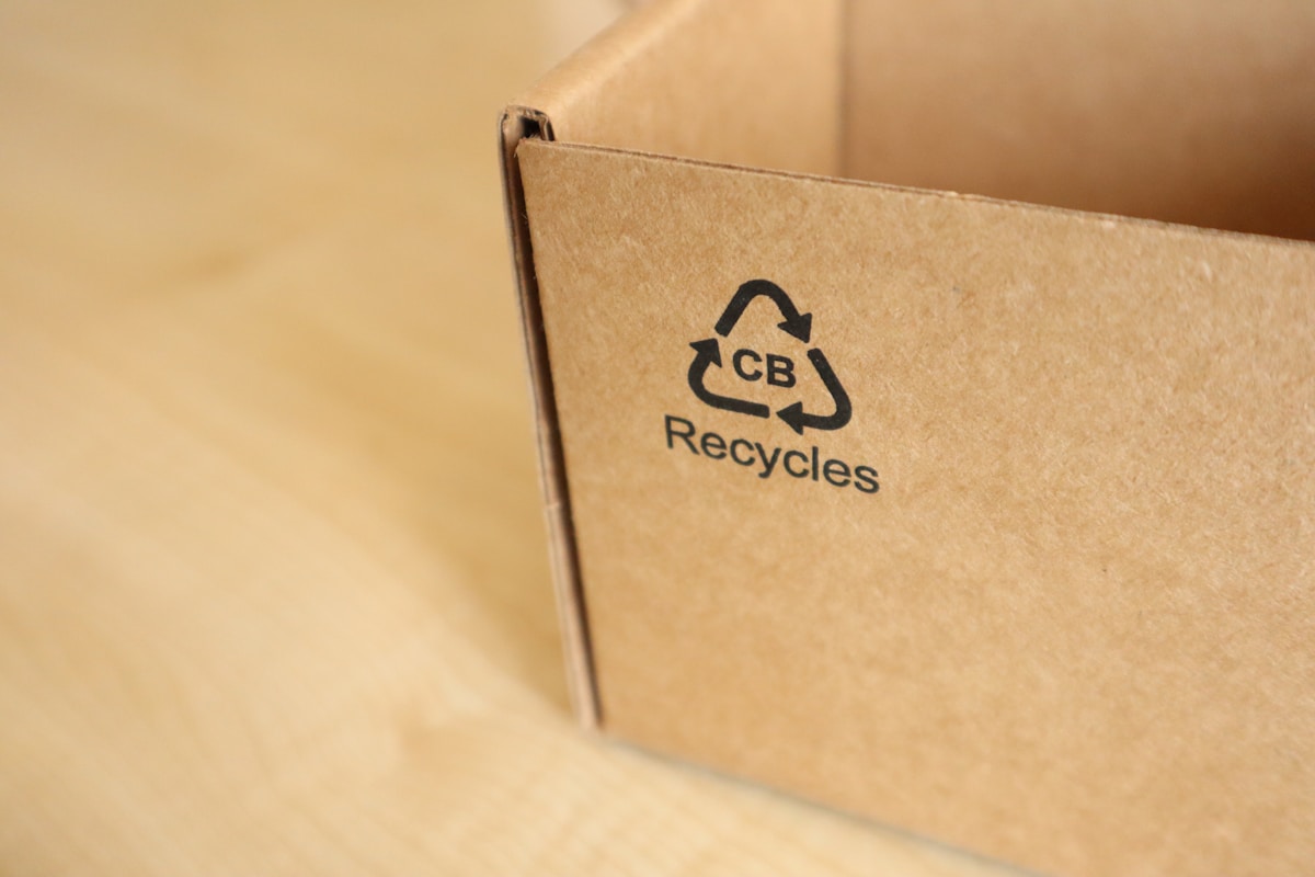 Cardboard packaging box with recycling logo
