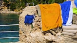 Guests enjoying freshly laundered towels by the pool.