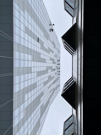 a couple of tall buildings next to each other