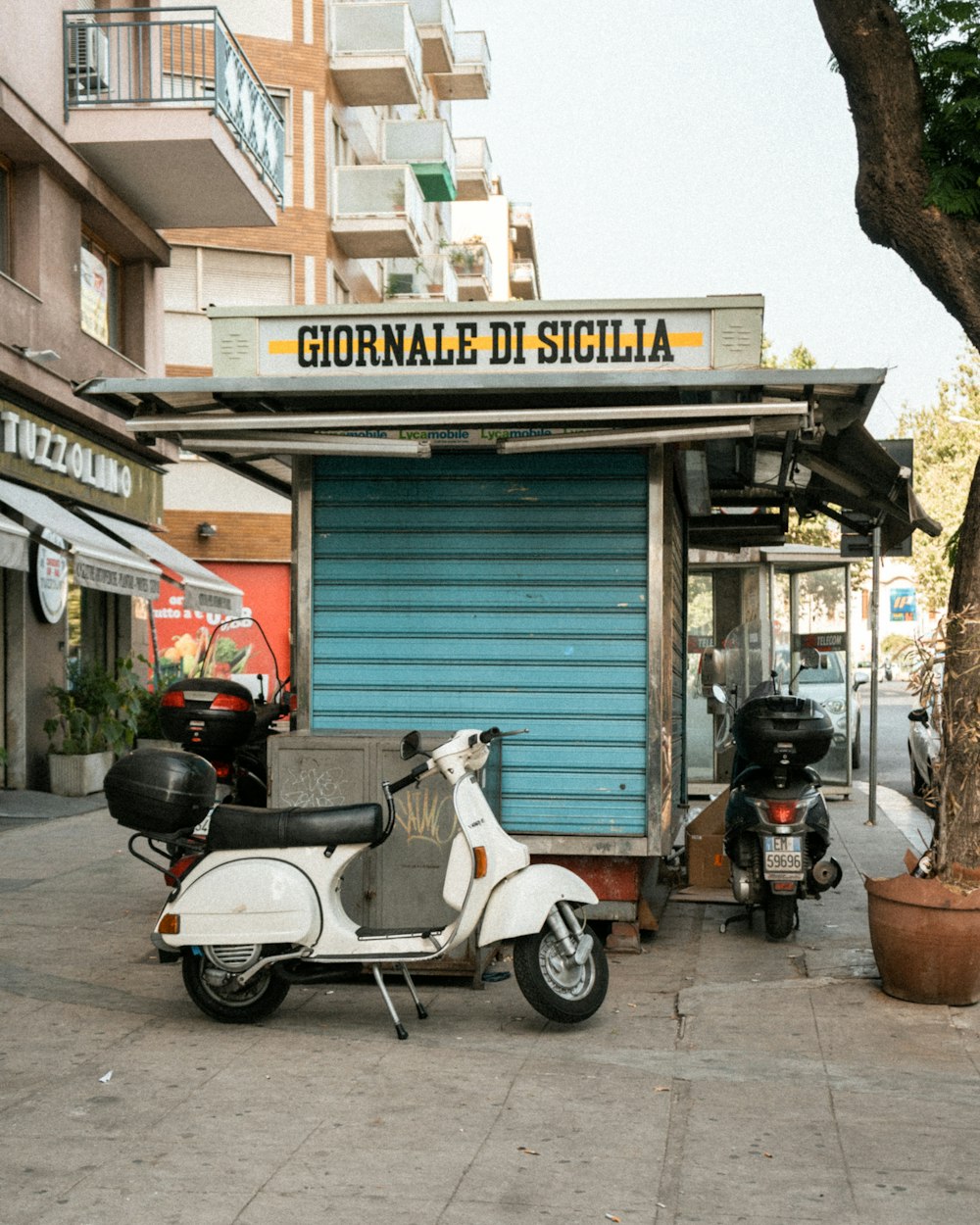 a scooter is parked in front of a store