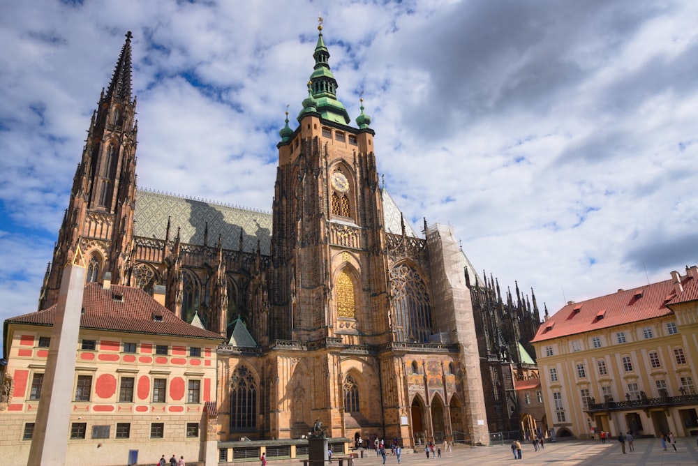 a large cathedral with a clock on it's side