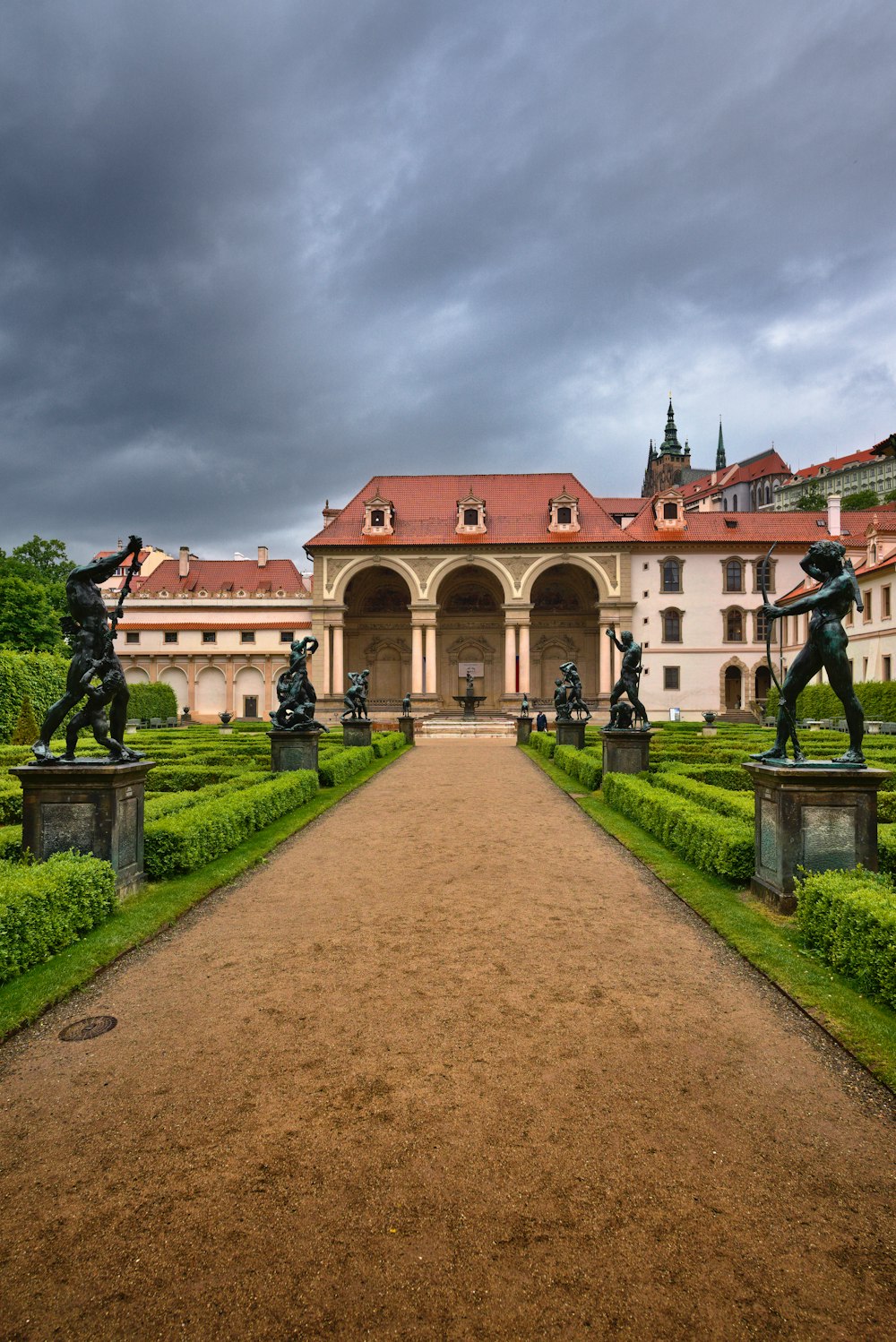 a large building with statues in front of it