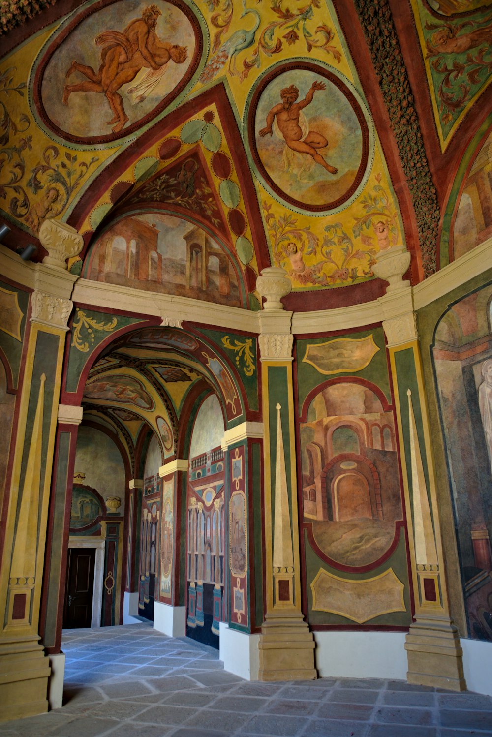 a large room with paintings on the walls