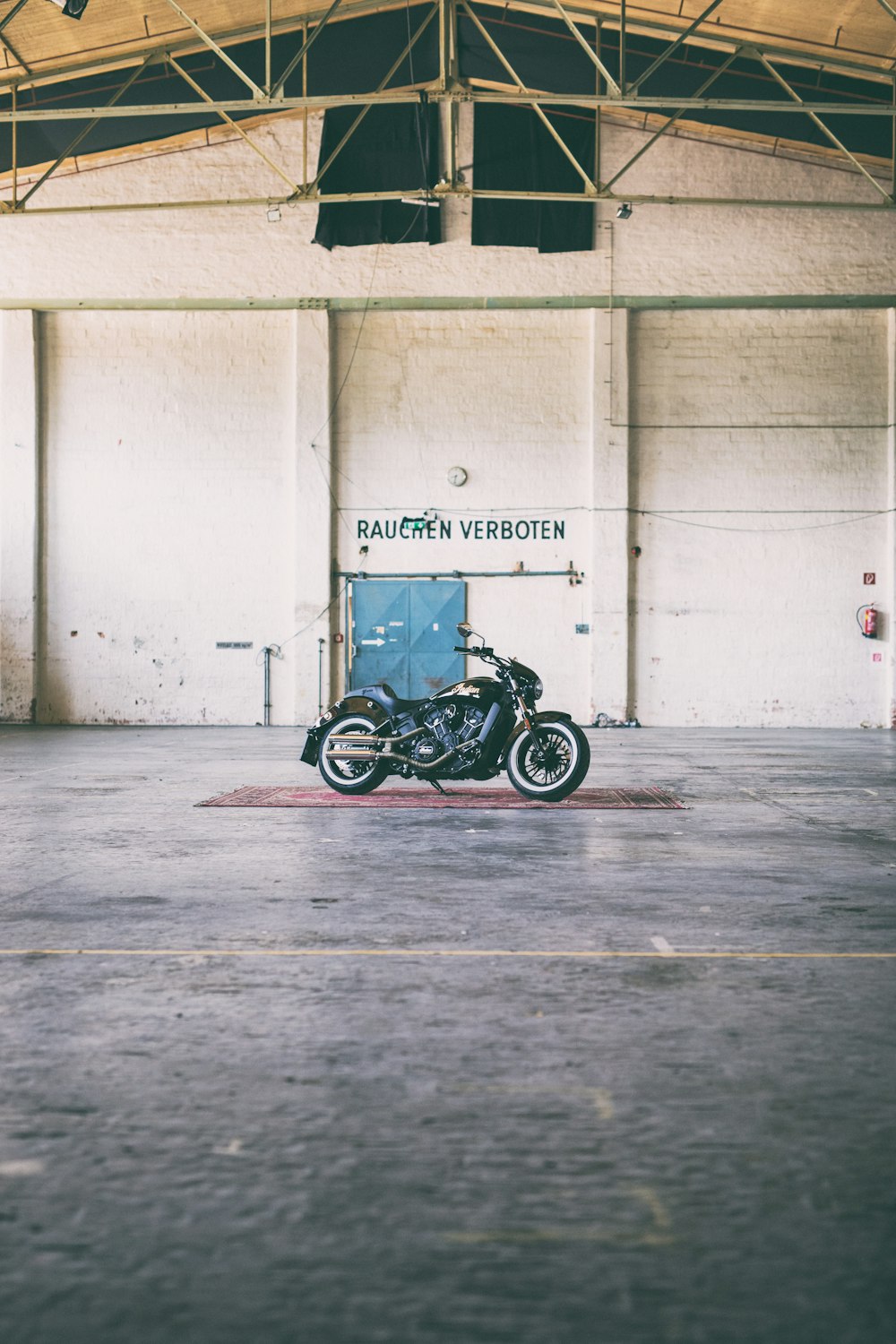 a motorcycle parked inside of a large building