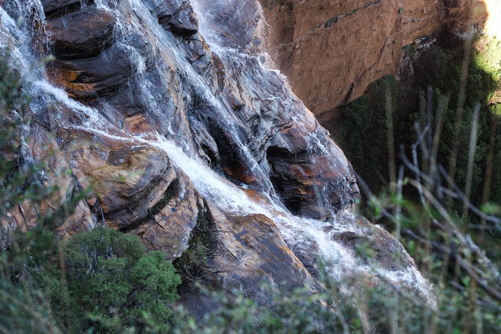 a waterfall flowing down the side of a mountain