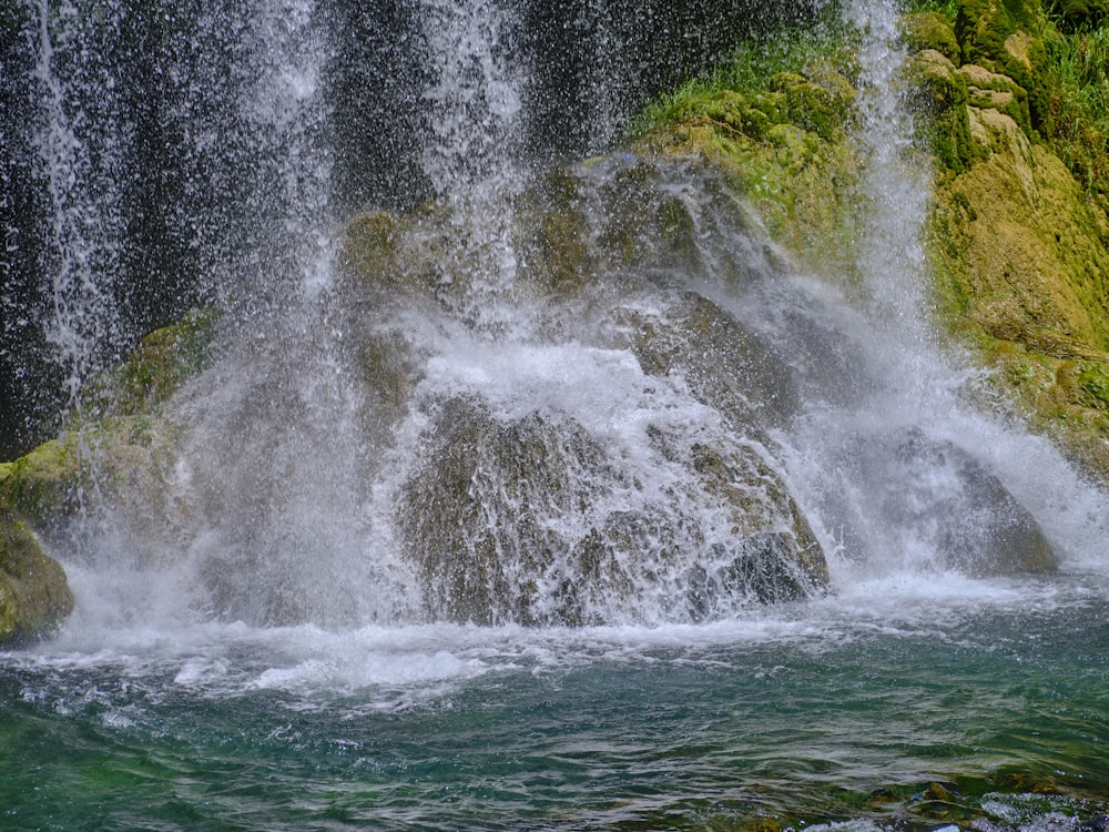 a large waterfall with lots of water coming out of it