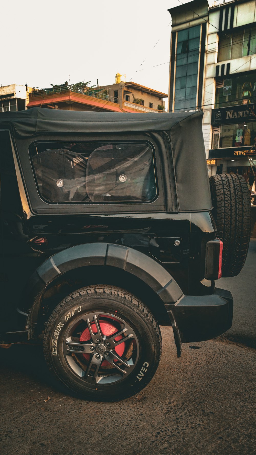 a black jeep parked on the side of the road