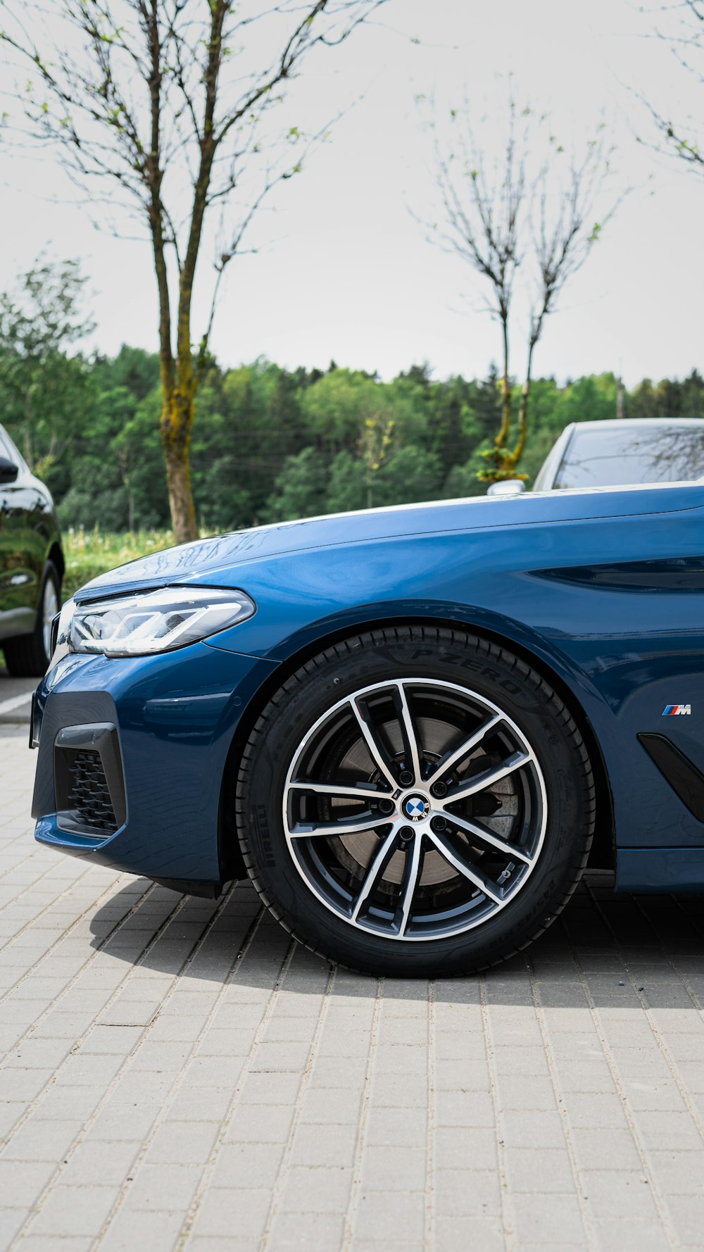 a blue sports car parked in a parking lot