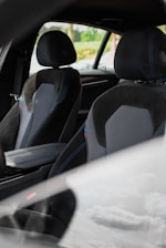 the interior of a car with black and gray seats