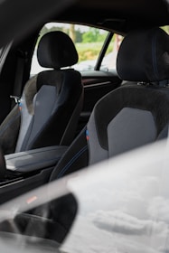 the interior of a car with black and gray seats