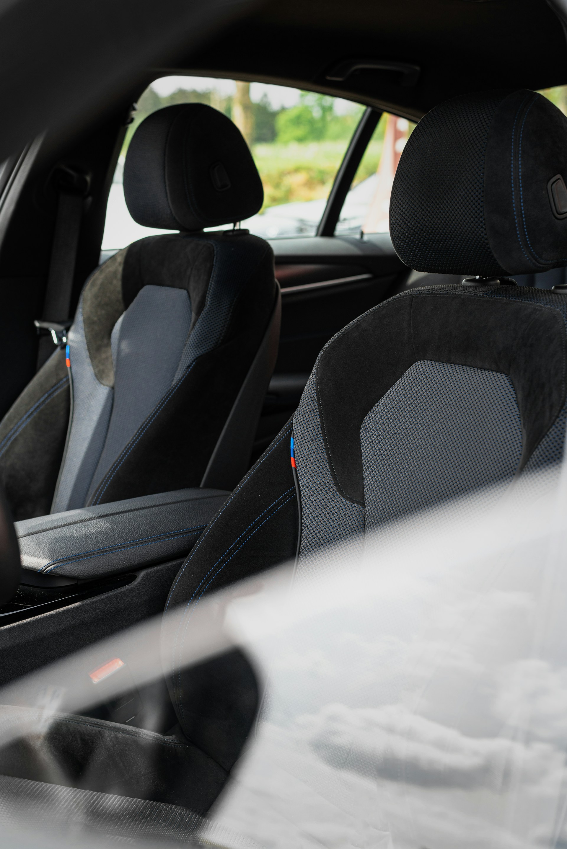 the interior of a car with black and gray seats