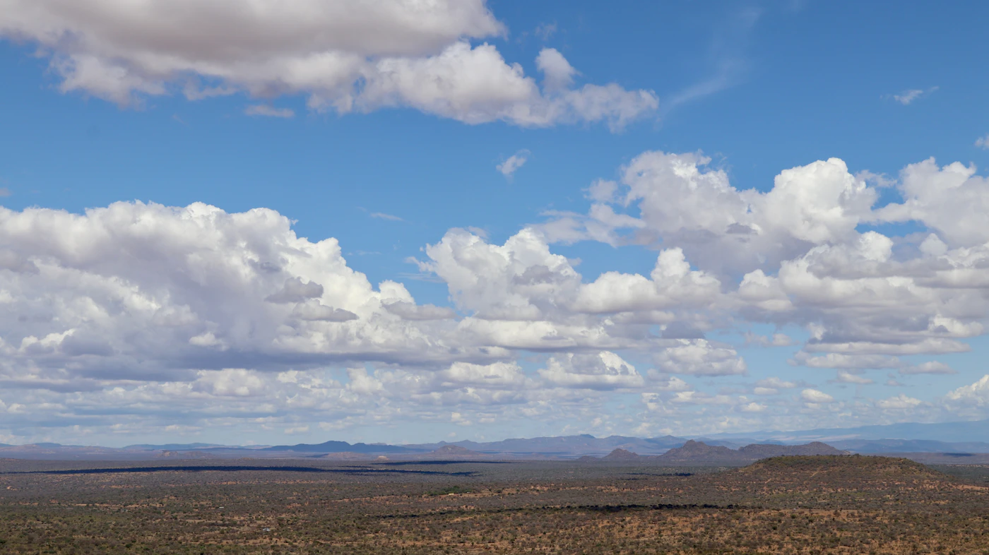 A mountain range holding cloud, the northern horizon Samburu guides read daily