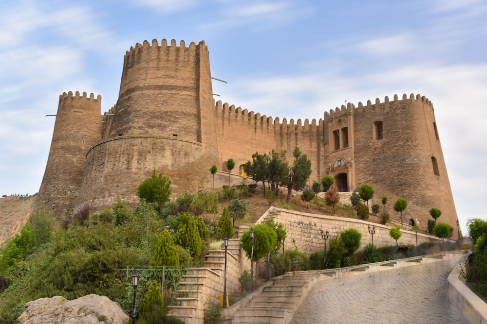 a very tall castle sitting on top of a hill