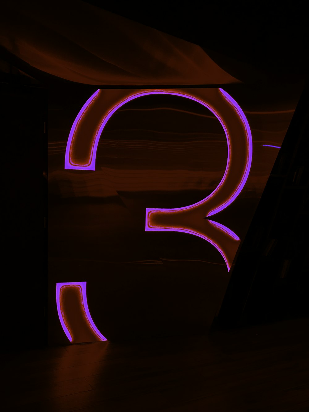 the letter q is lit up in the dark