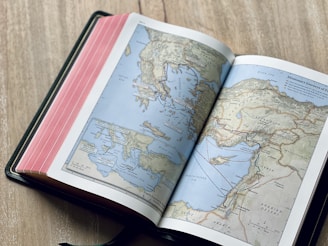 an open book with a map of the world on it