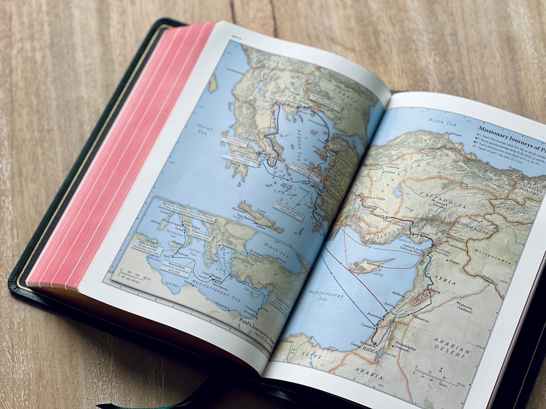 an open book with a map of the world on it