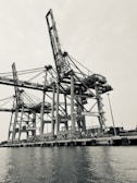 a black and white photo of a large crane