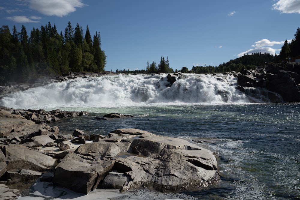 a large waterfall with water coming out of it