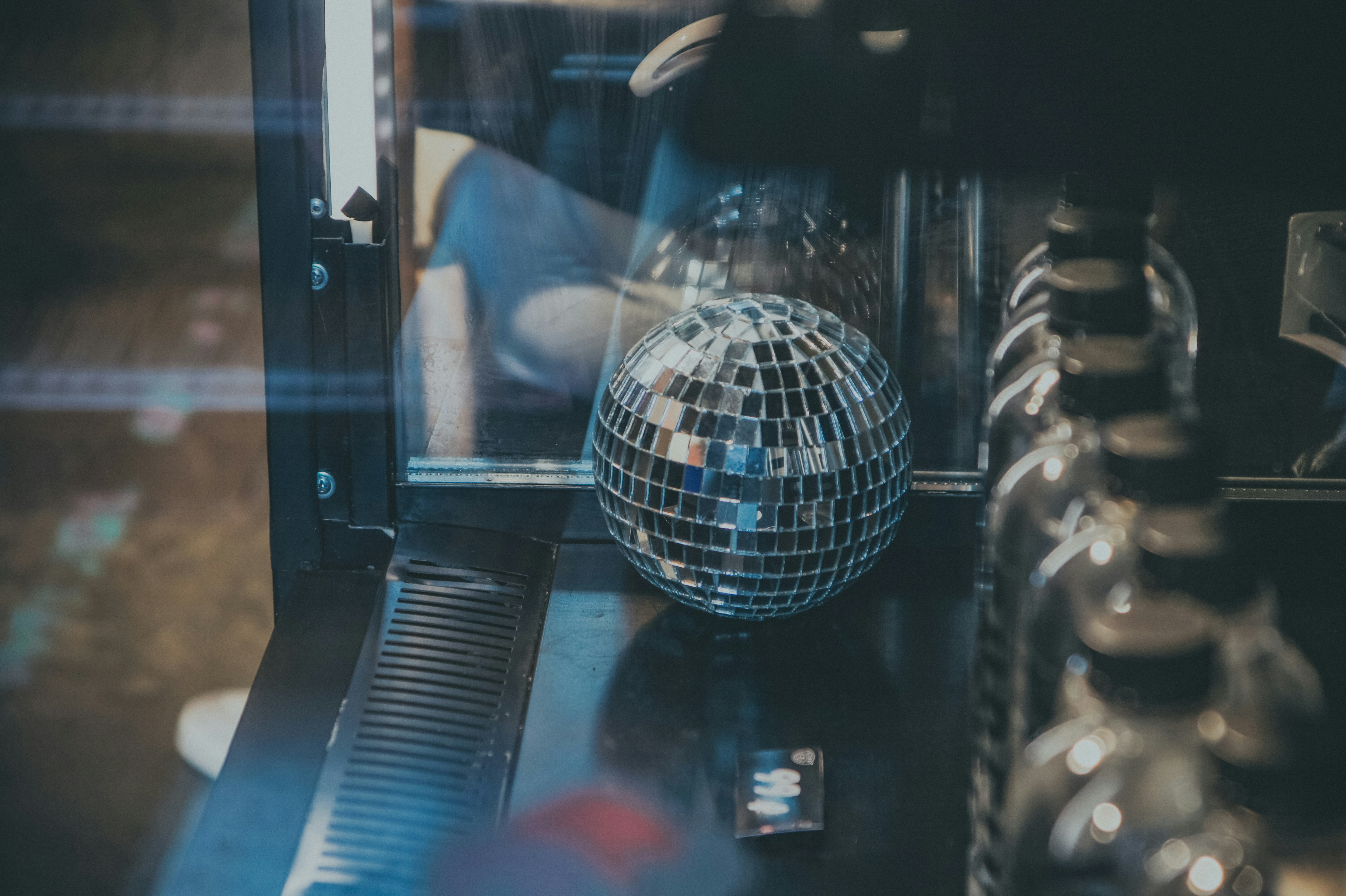 a disco ball sitting on top of a black table