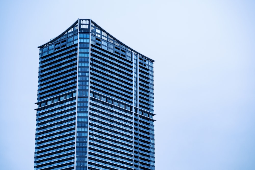 a very tall building with a sky background