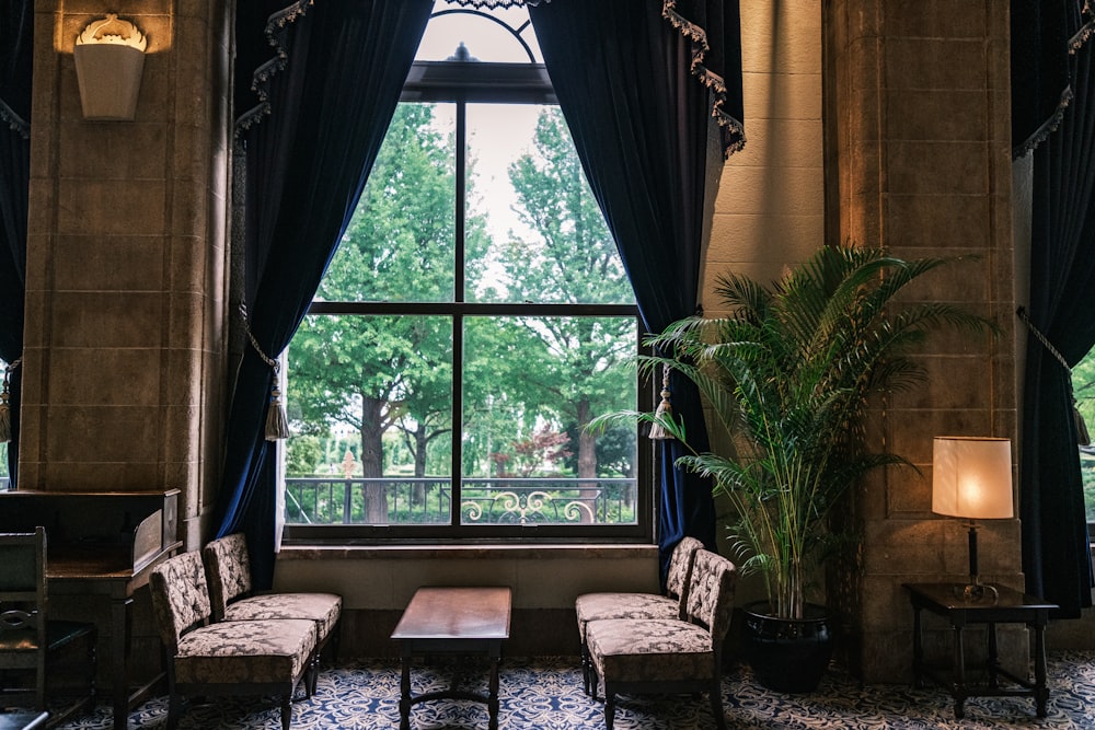 a living room filled with furniture and a large window