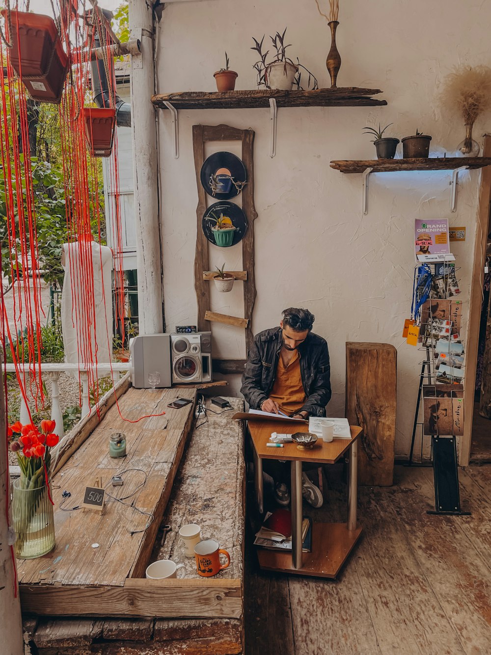 a man sitting at a table in a room