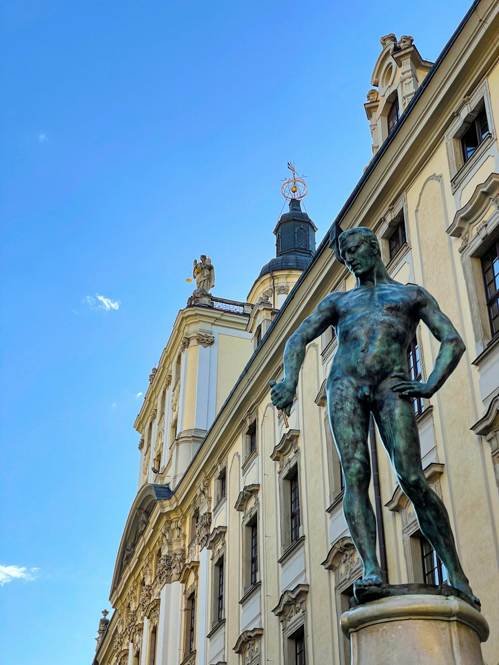 a statue of a man in front of a building