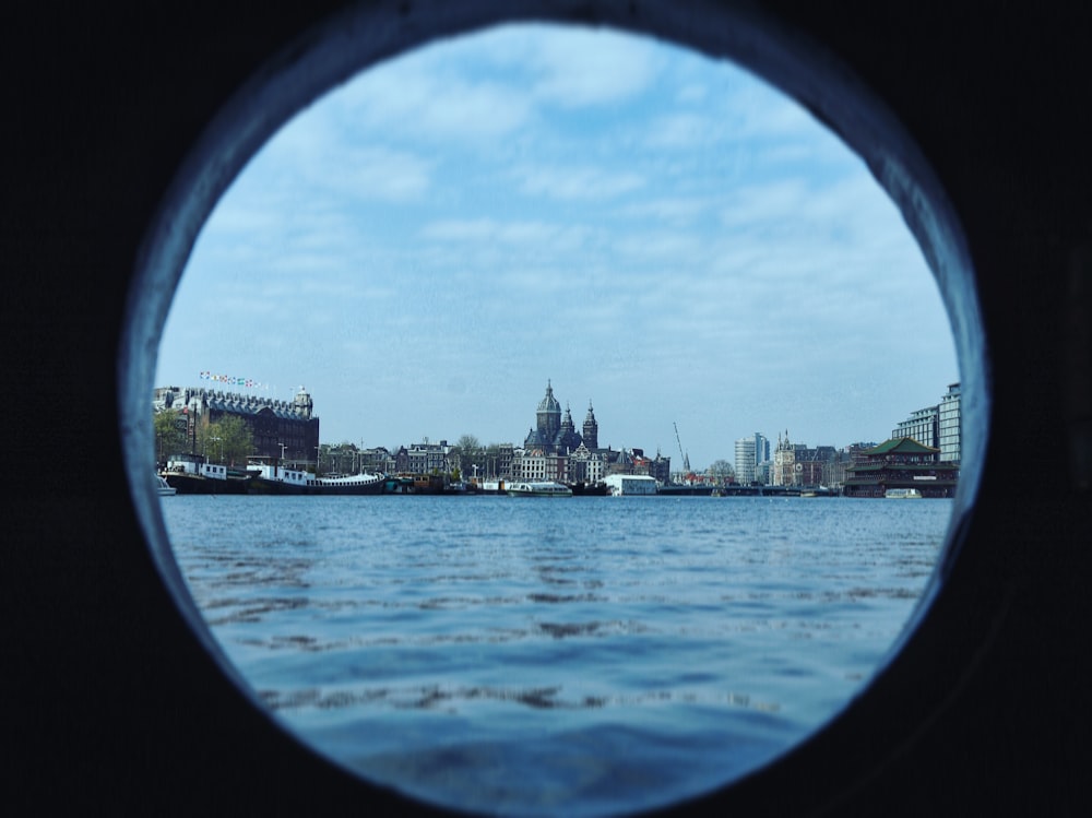 a view of a city from a porthole in the water