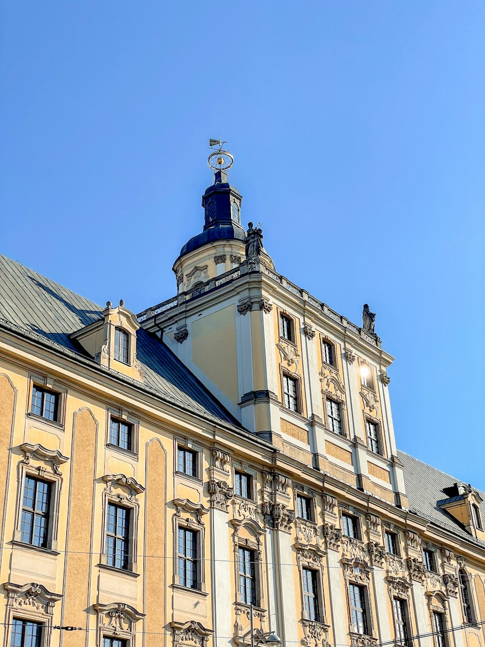 a tall building with a clock on the top of it