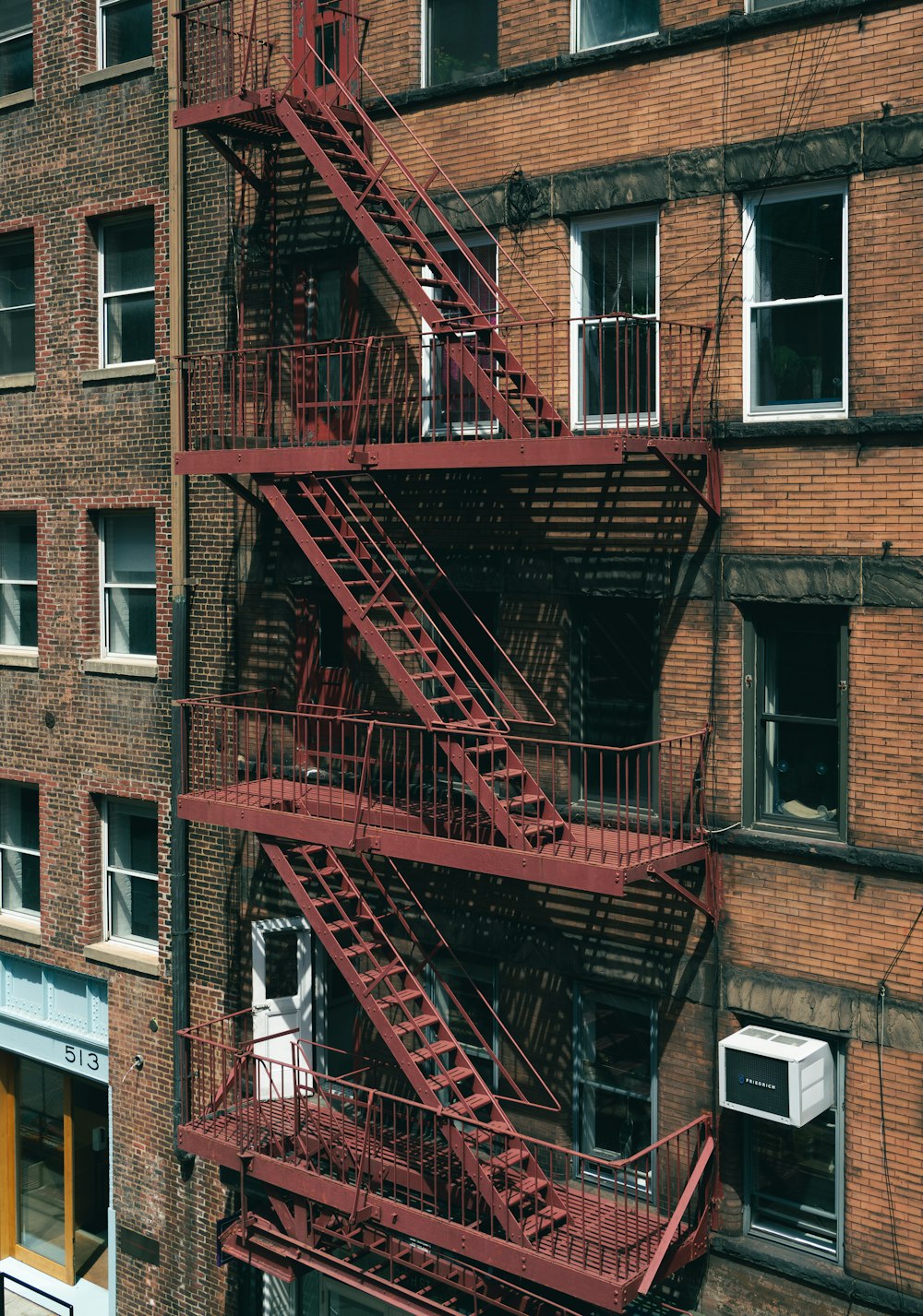 a fire escape on the side of a brick building