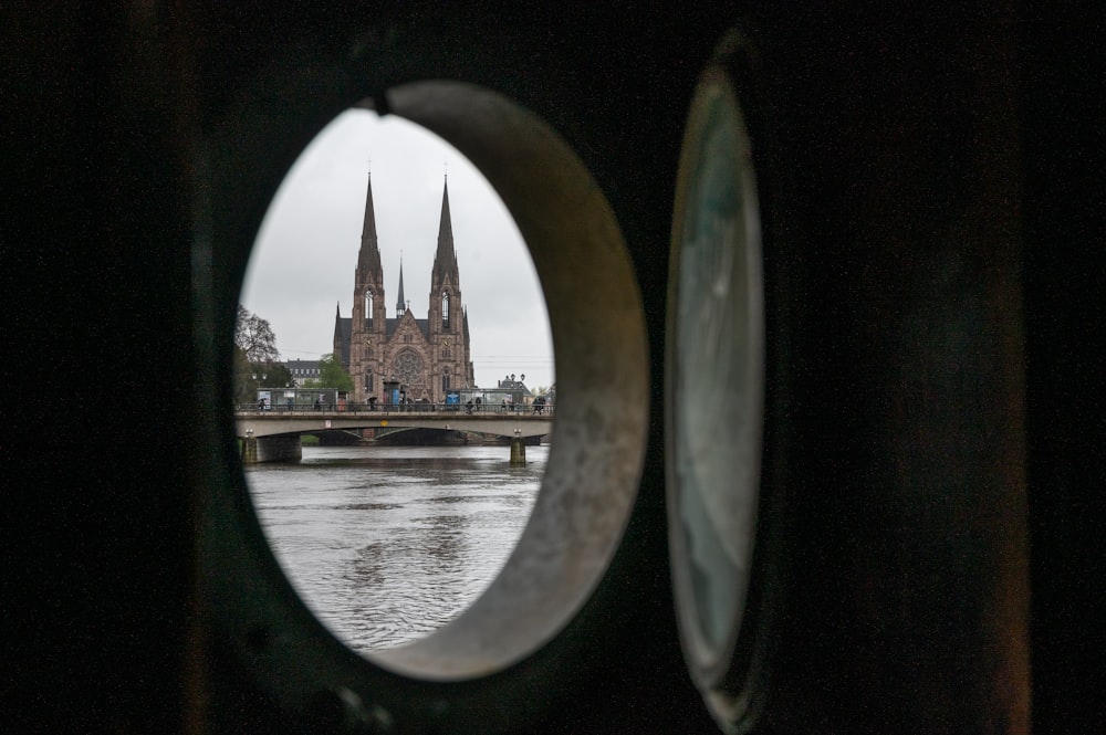a view of a cathedral through a porthole