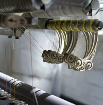 a close up of a machine working on a piece of fabric