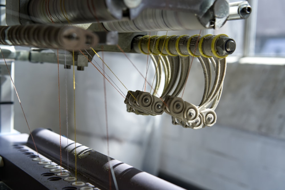 a close up of a machine working on a piece of fabric