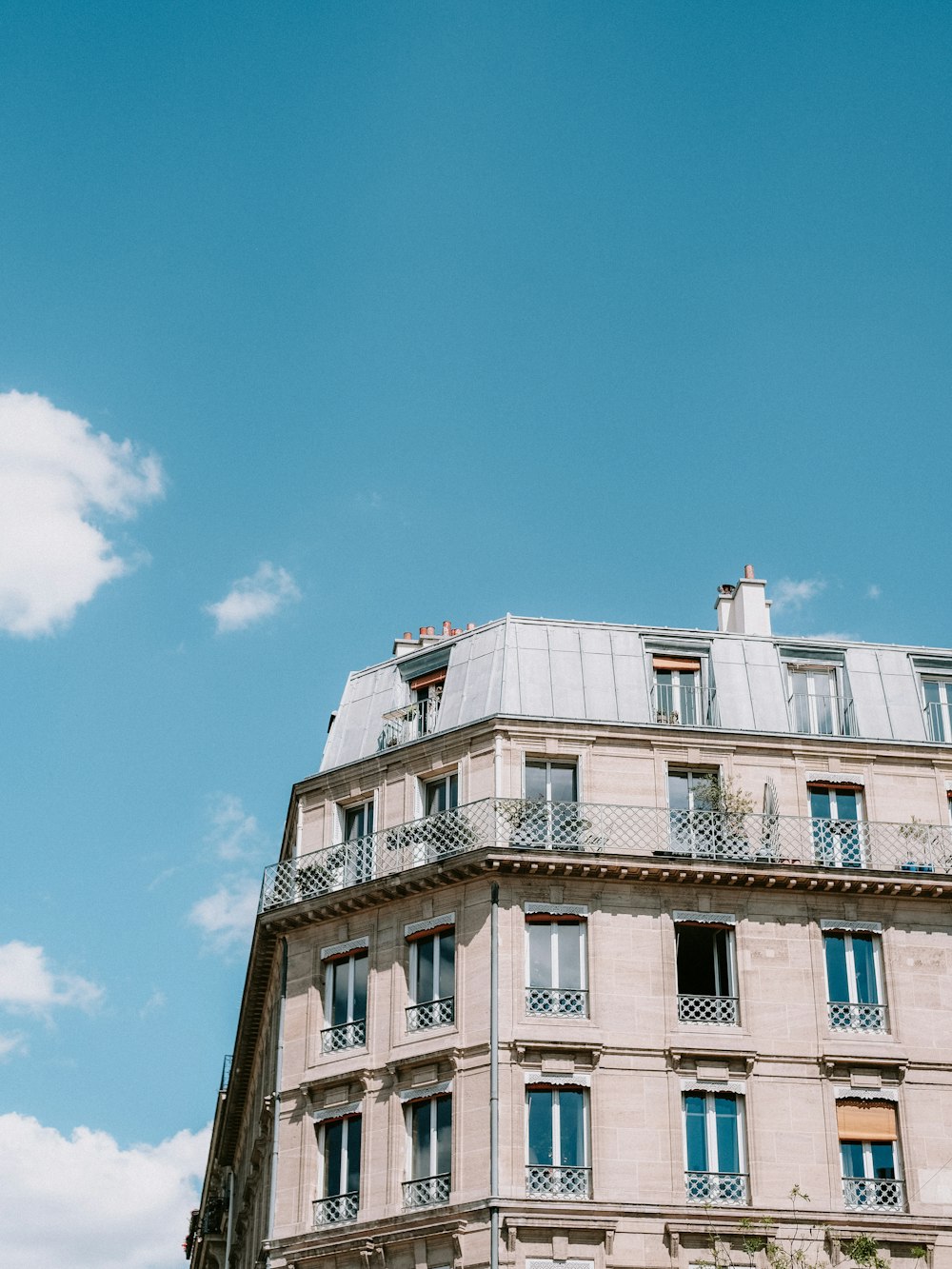 a tall building with balconies and balconies on the top of it