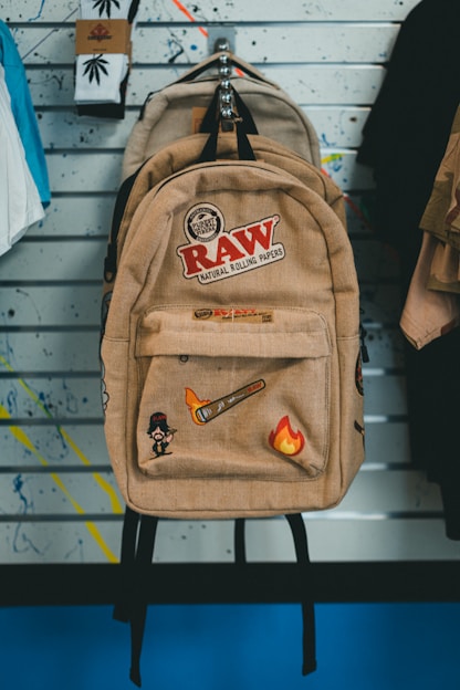 a back pack sitting on top of a chair