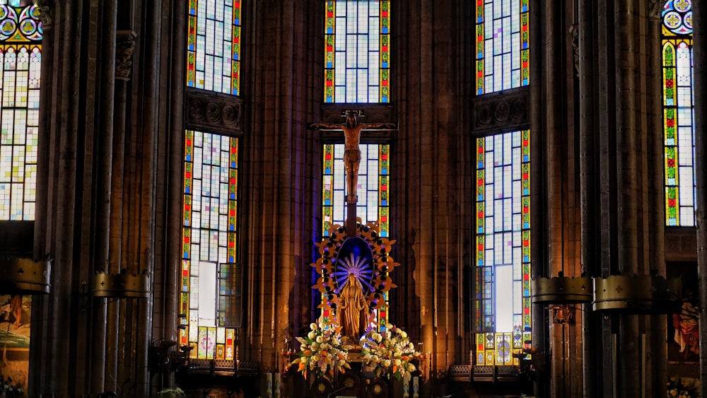 a church with stained glass windows and a alter
