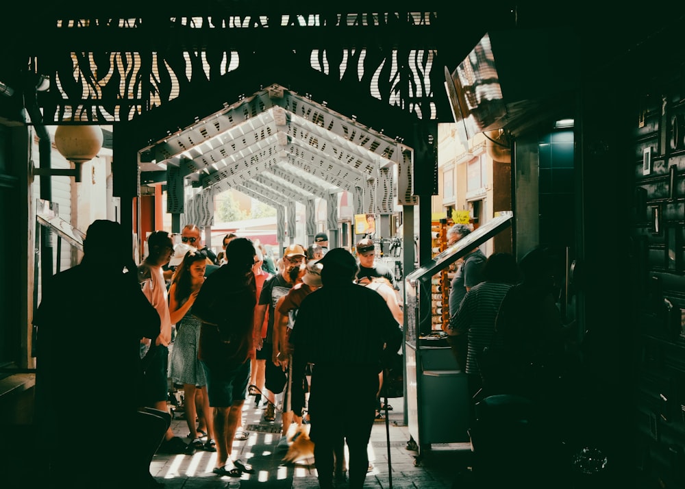 a group of people walking down a hallway