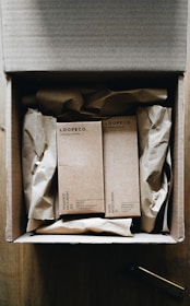 a box with three books inside of it