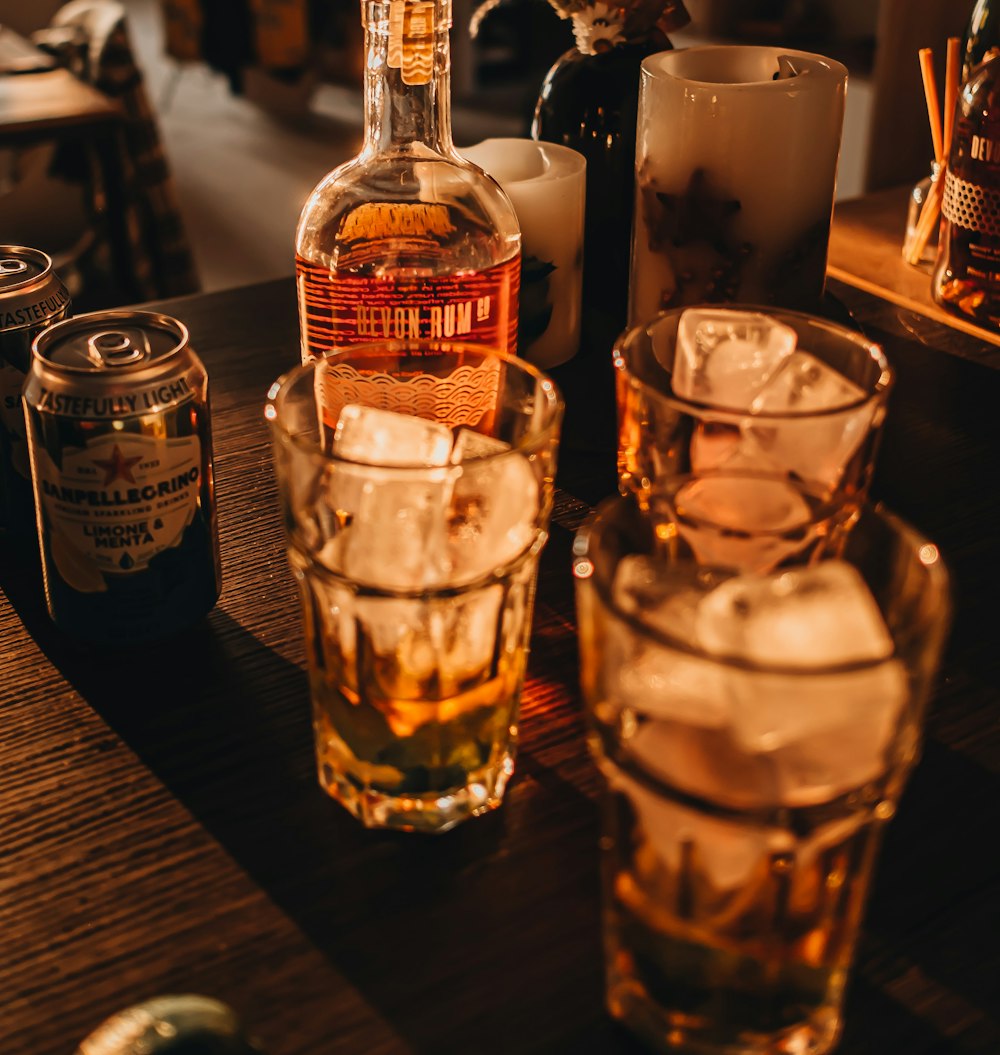 a bottle of whiskey sitting on top of a wooden table