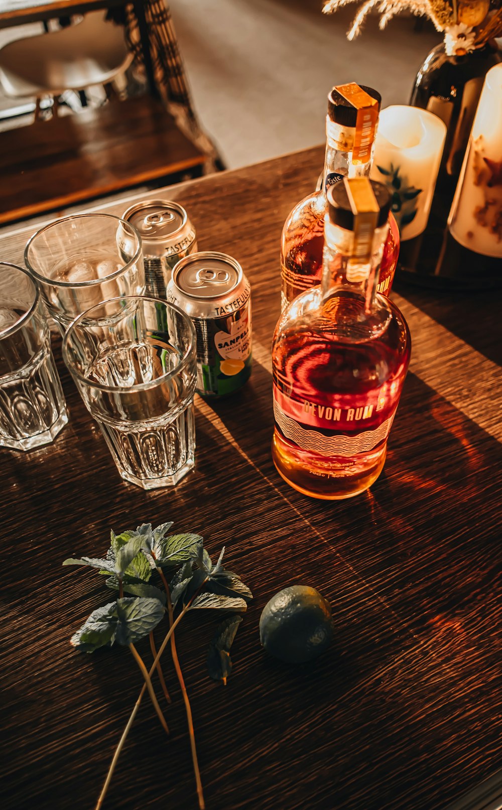 a bottle of liquor sitting on top of a wooden table