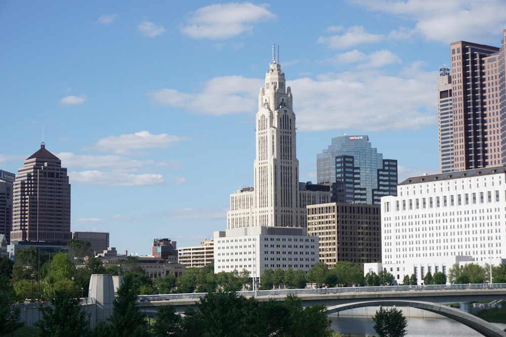 a view of a city with a bridge in the foreground