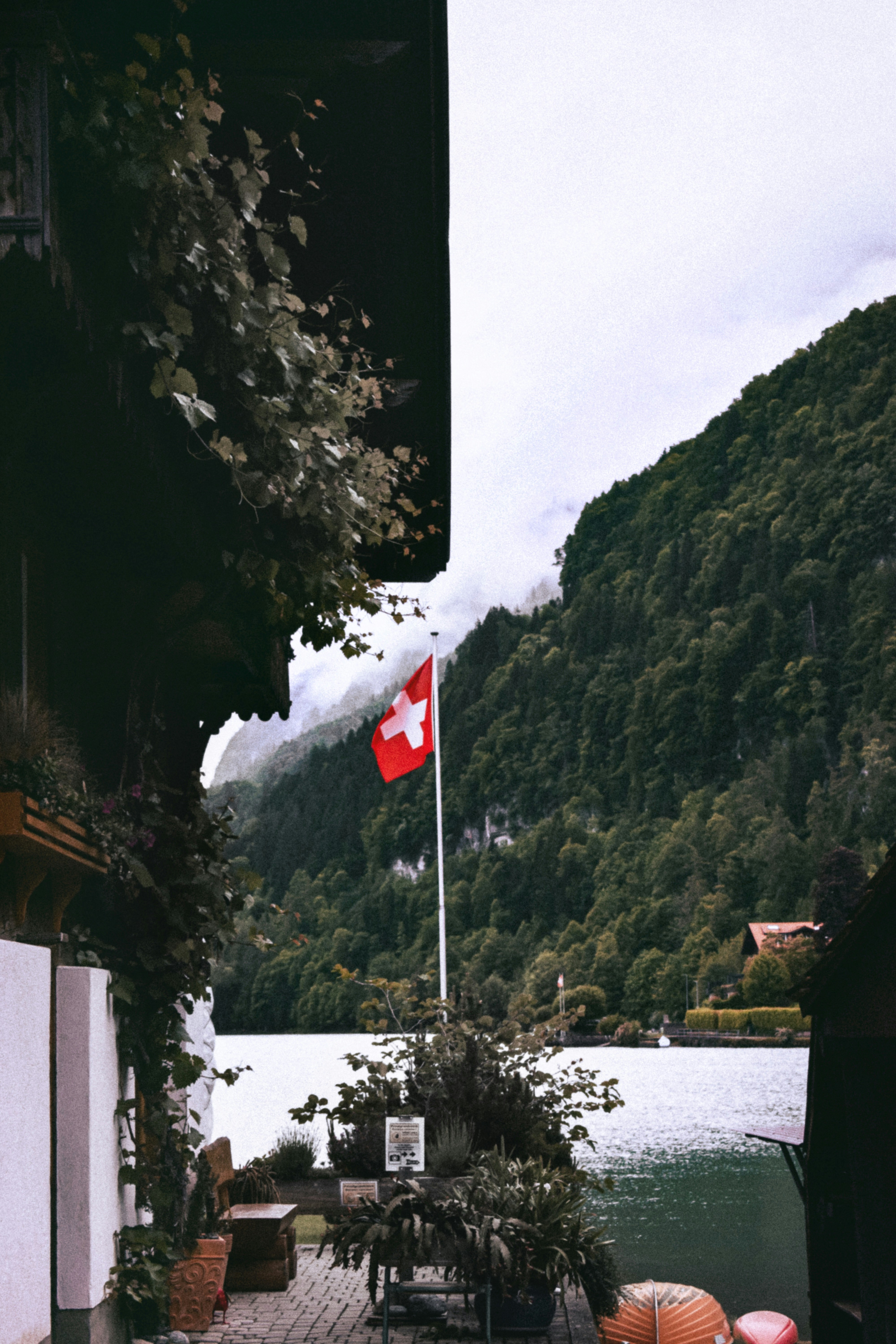 a canadian flag flying over a body of water
